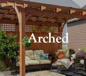 A arched pergola with modern couch and table