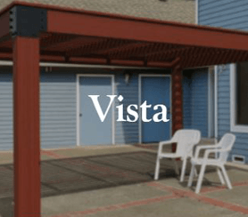 A brown pergola with a white chair