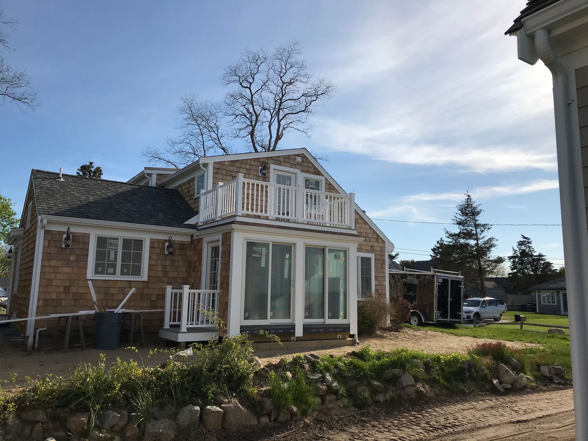 A small house with a balcony on top of it