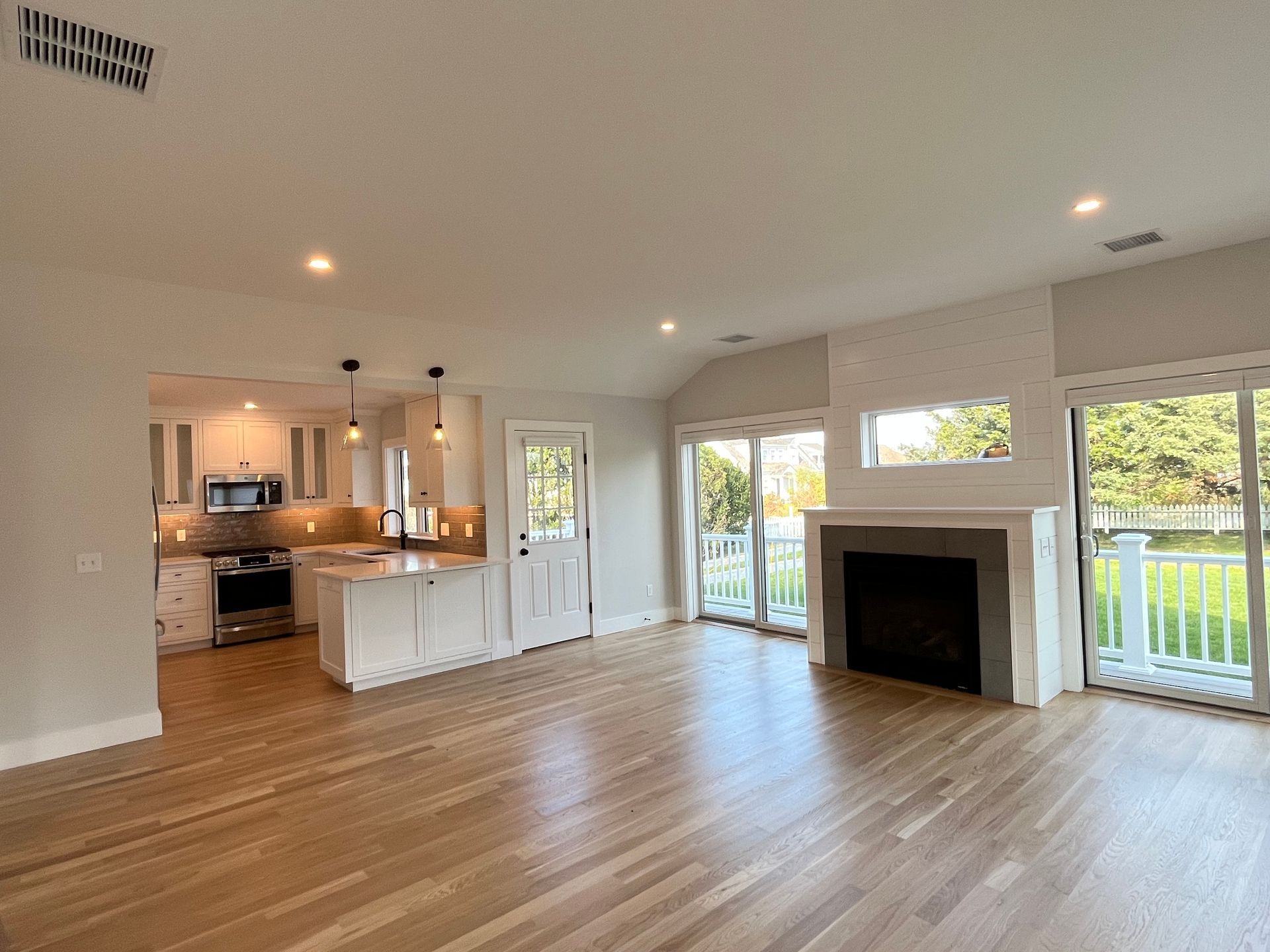 There is a fireplace in the middle of the living room