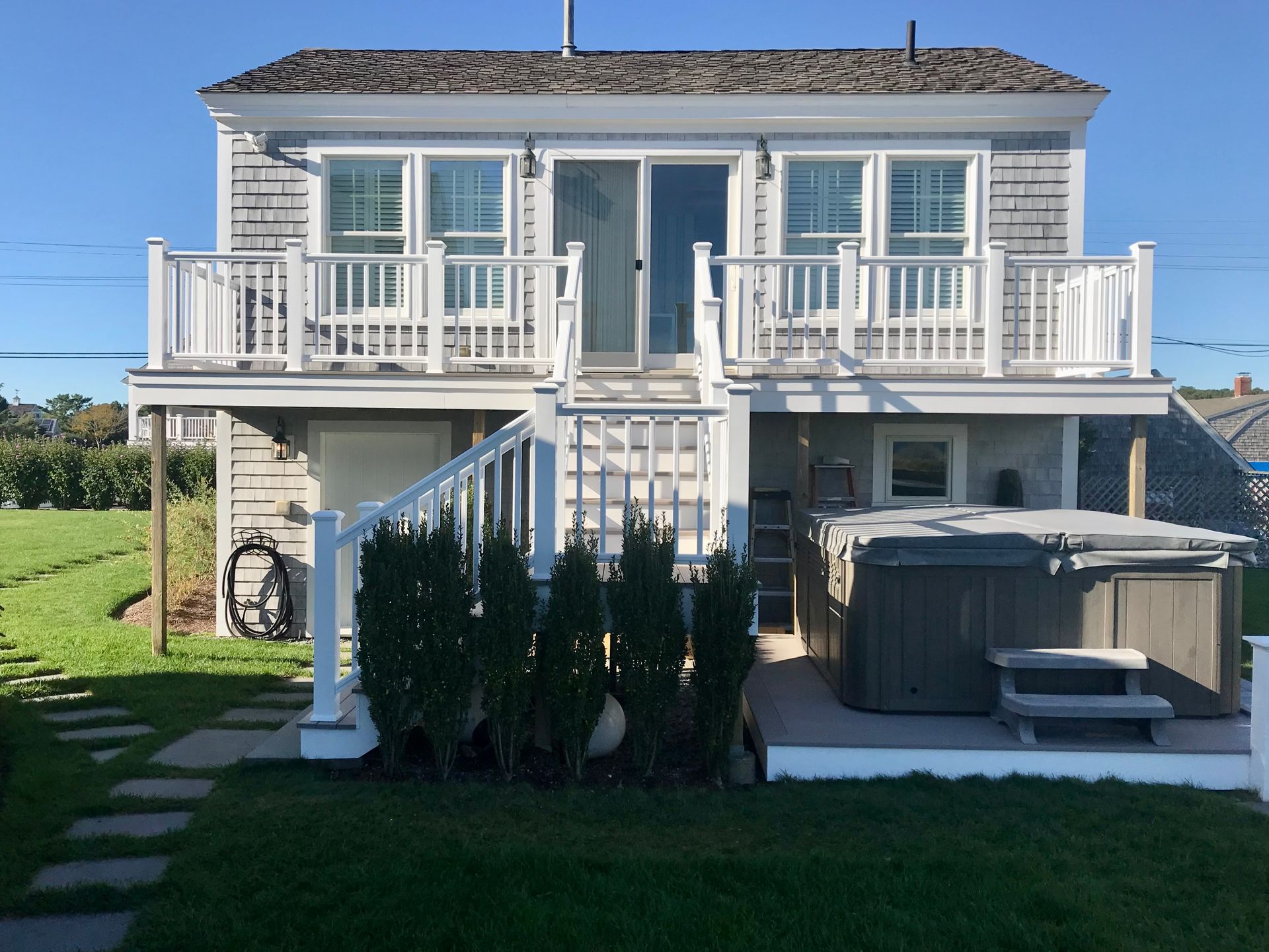 A house with a hot tub in the backyard