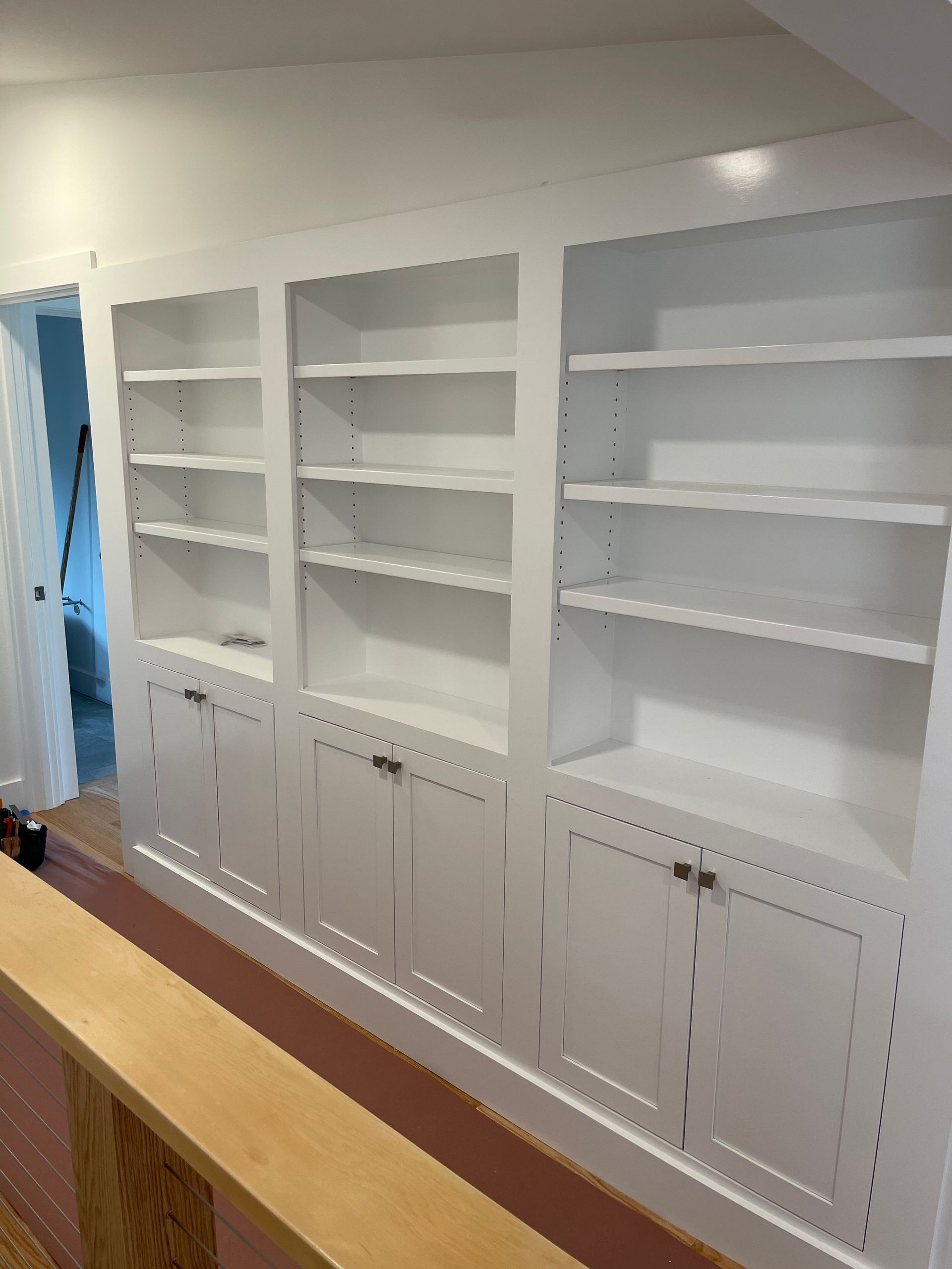 There are a lot of shelves and cabinets in this room