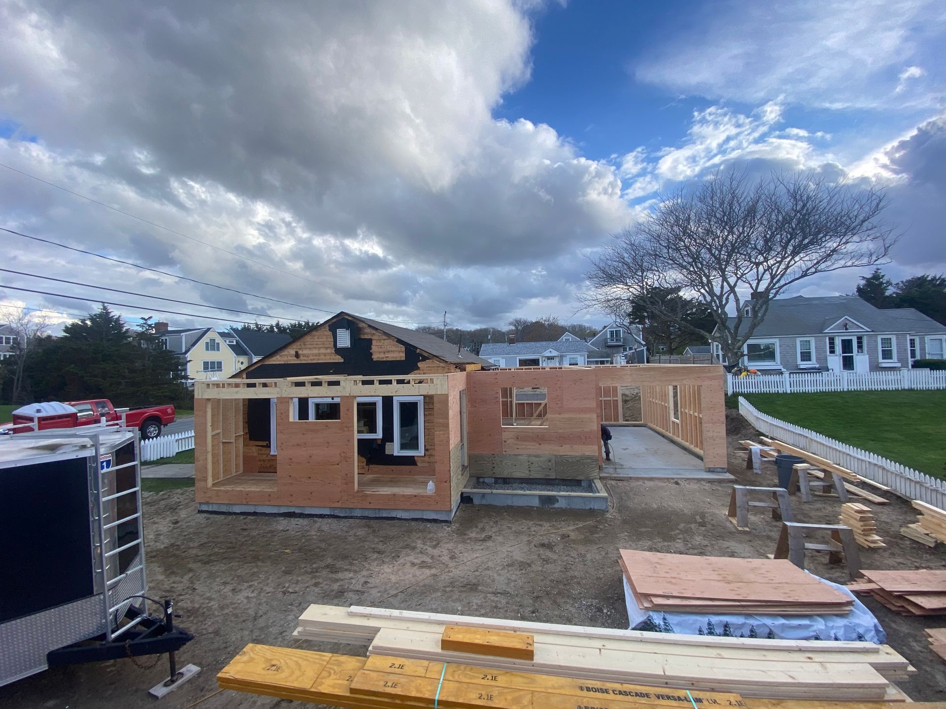 A house is being built in the middle of a dirt field