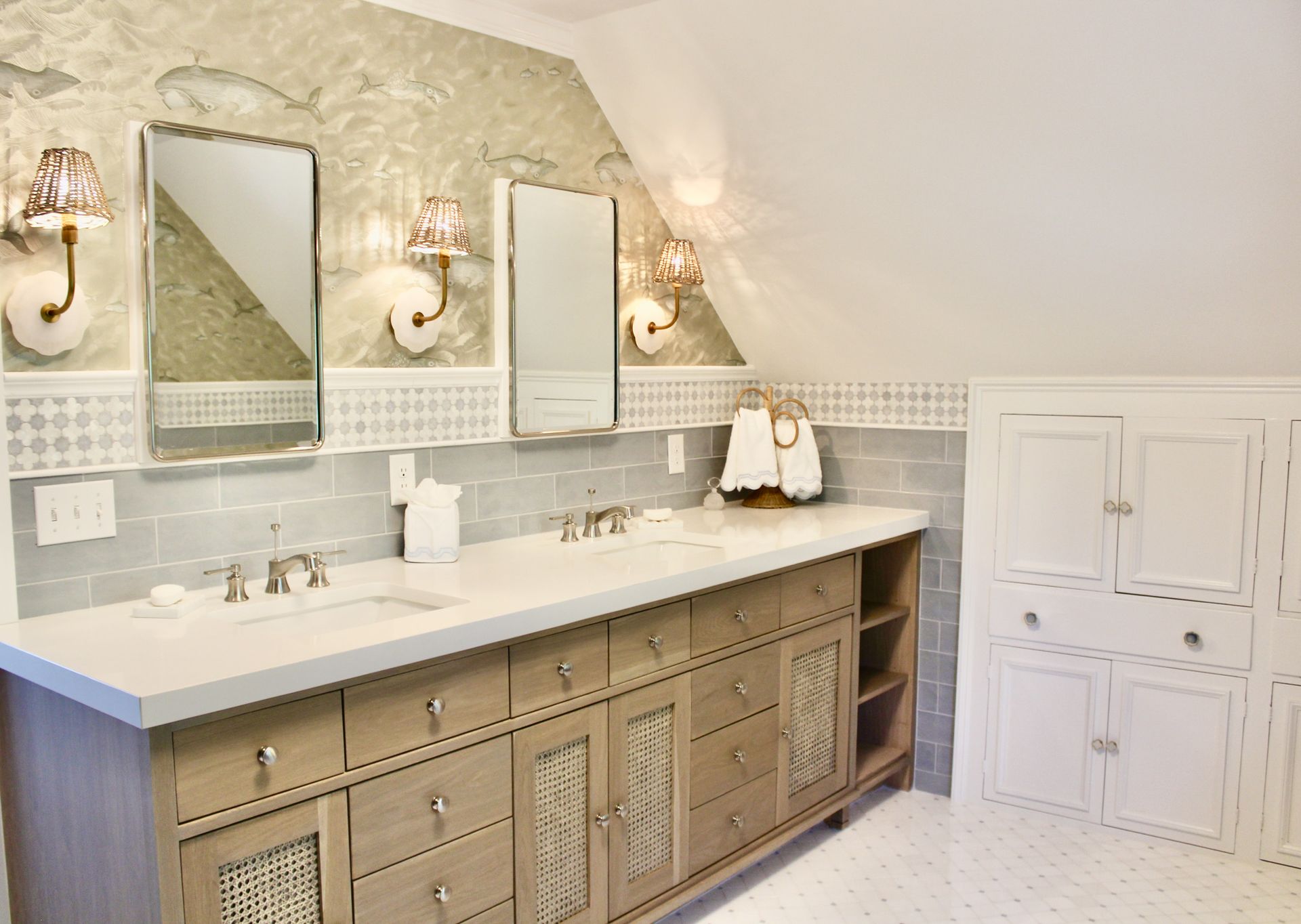 A bathroom with two sinks and two mirrors