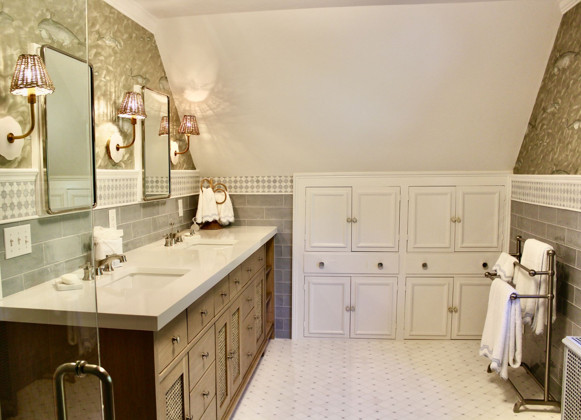 A bathroom with two sinks and two mirrors