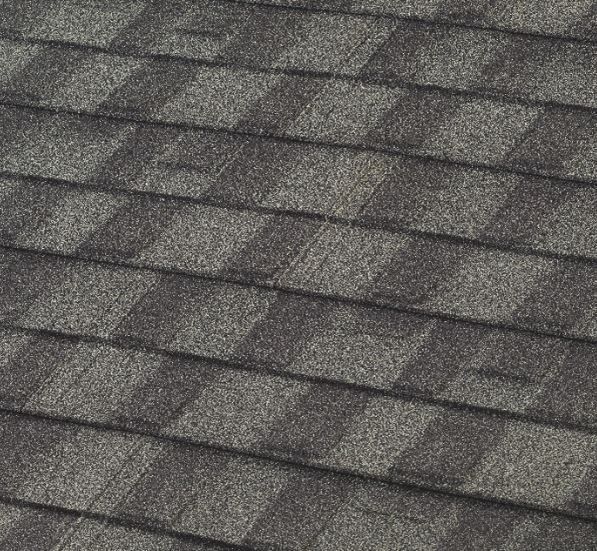 Close-up of a gray asphalt shingle roof.