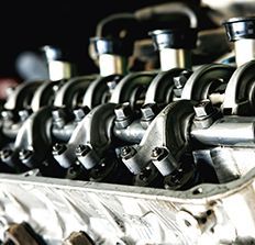 A close up of the inside of a car engine.