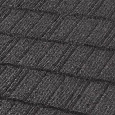 Close-up of a dark gray metal roof with a textured, shingle-like pattern.