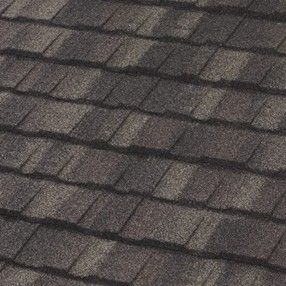 Dark gray asphalt roof shingles, angled view.