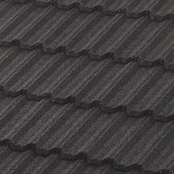 Close-up of dark gray, textured roofing tiles with scalloped edges.