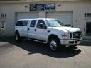 White pickup truck parked outside a building loading dock