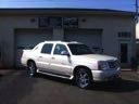 White pickup truck parked outside a building.