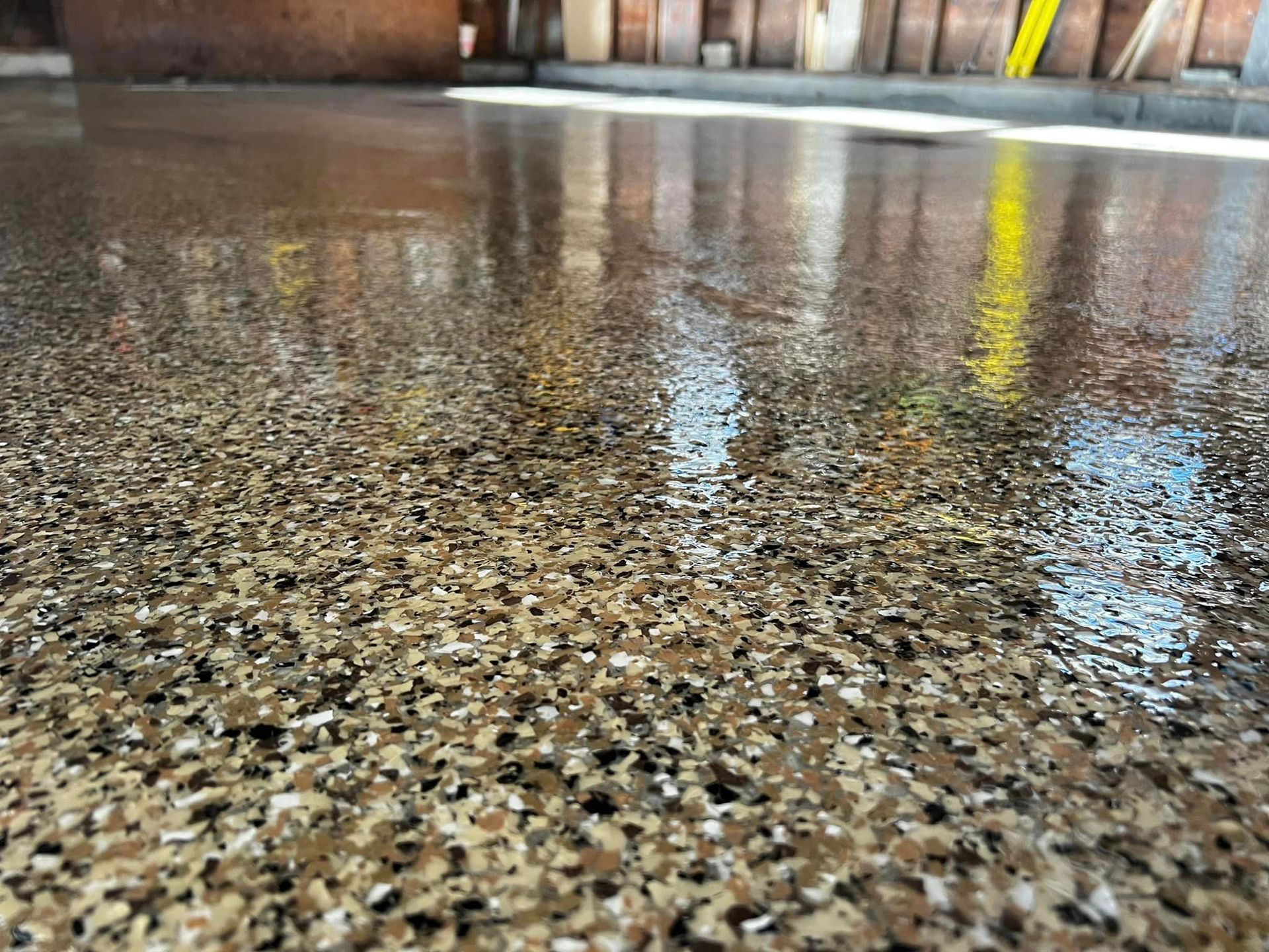 A close-up of a shiny concrete floor in a garage