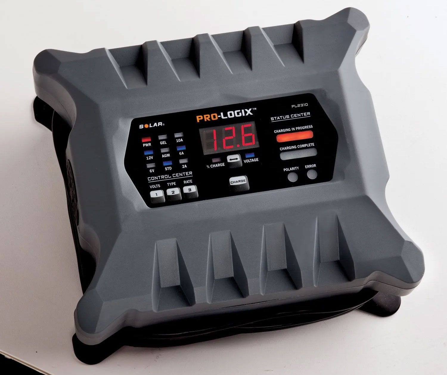 A prologix battery charger is sitting on a table