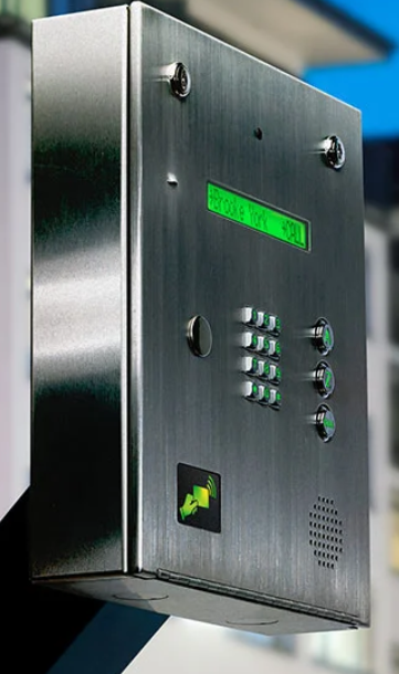 A stainless steel box with buttons and a green screen.