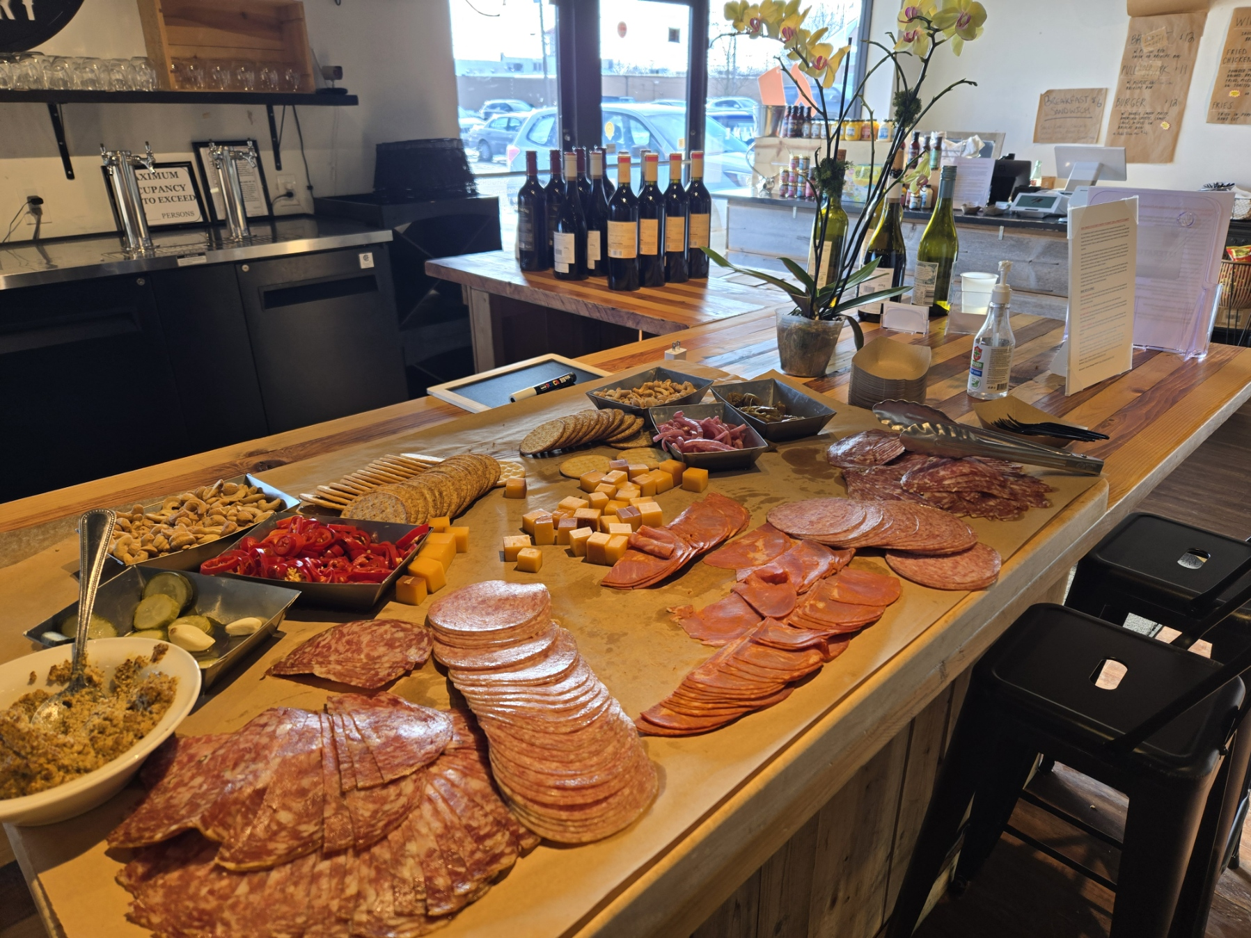 A table with a variety of meats and cheeses on it
