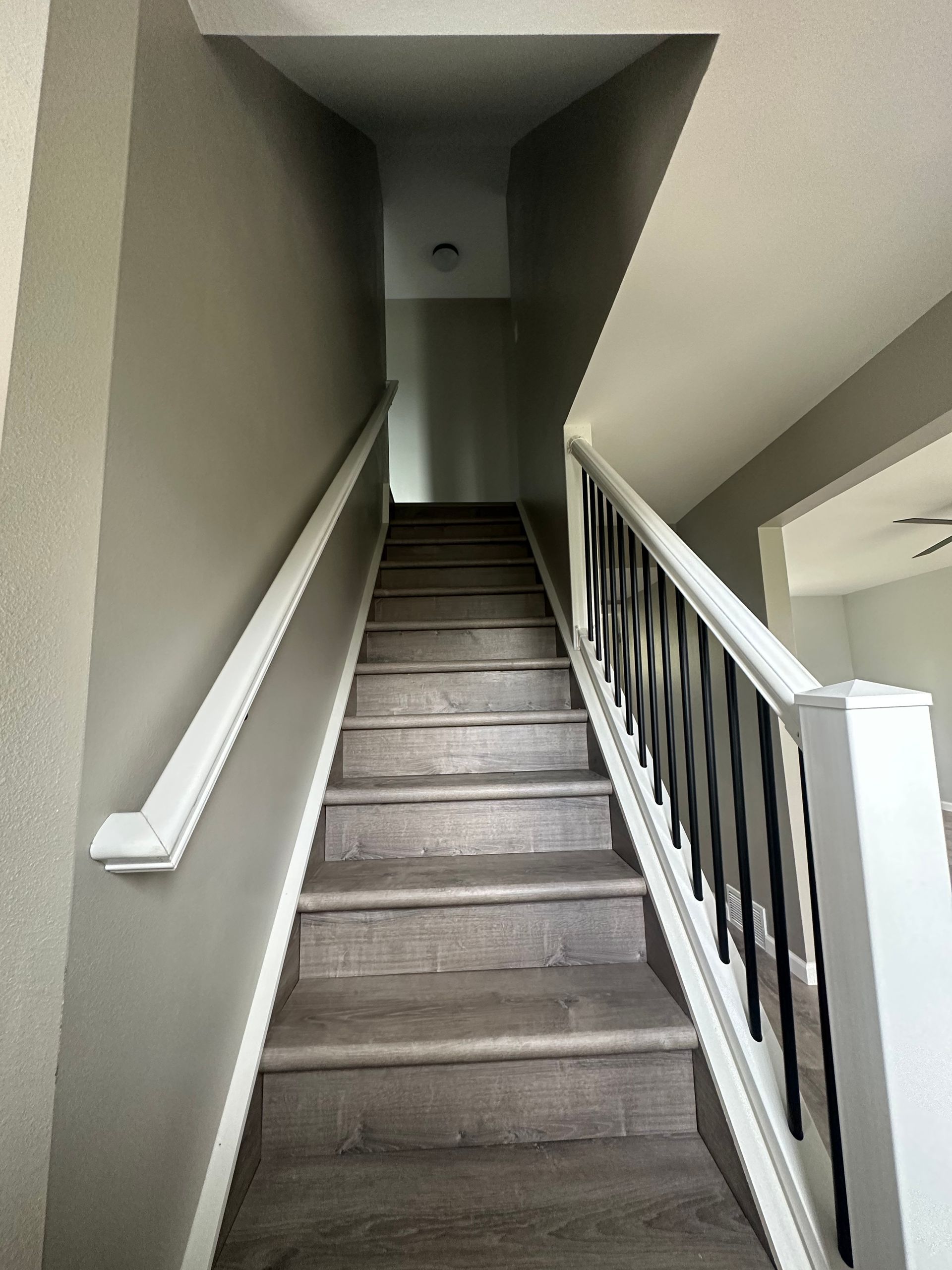 A set of stairs leading up to the second floor of a house