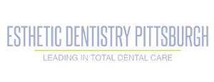 A logo for esthetic dentistry pittsburgh leading in total dental care
