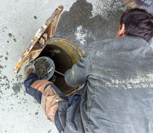 Worker on septic inspection