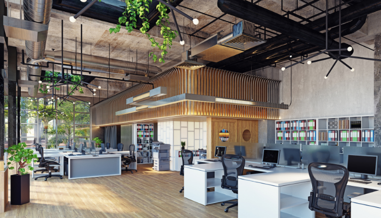 Modern office interior with open desks, plants, and natural wood accents.