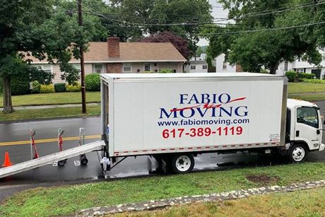 A fabio moving truck is parked on the side of the road