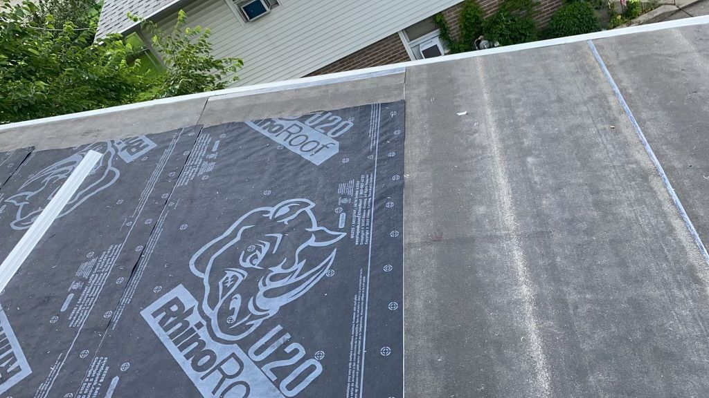 Roof with RhinoRoof U20 underlayment being installed.