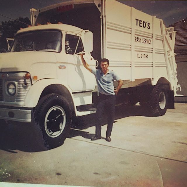 Man standing beside a white TED’S moving truck in a sunny driveway