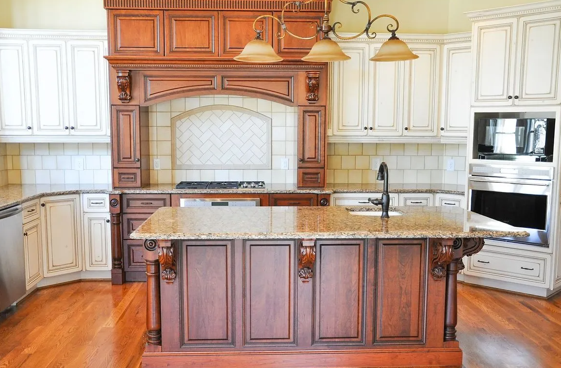 A kitchen with wooden cabinets and granite counter tops