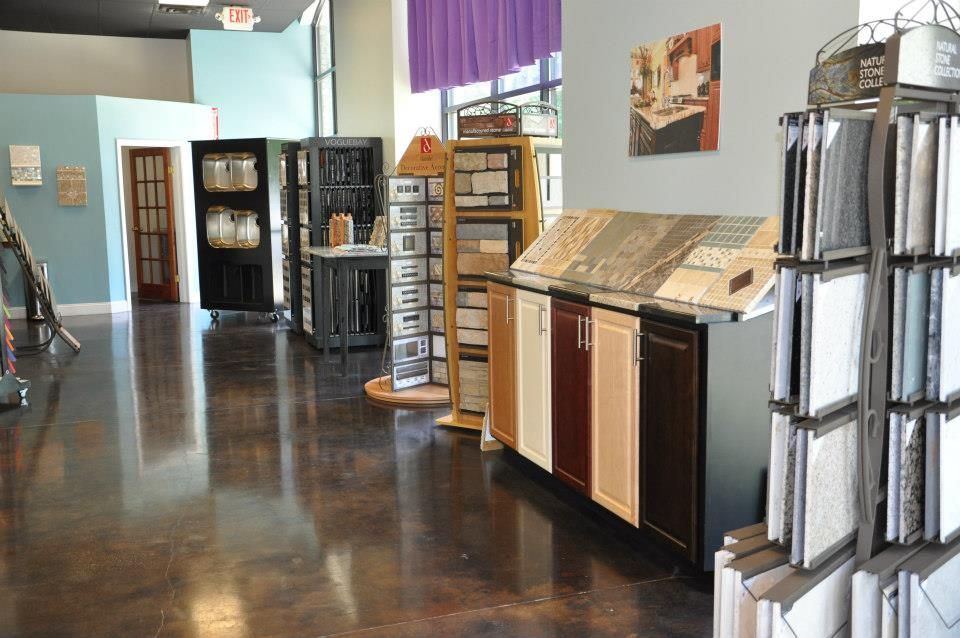 A room with a lot of cabinets and tiles on display.