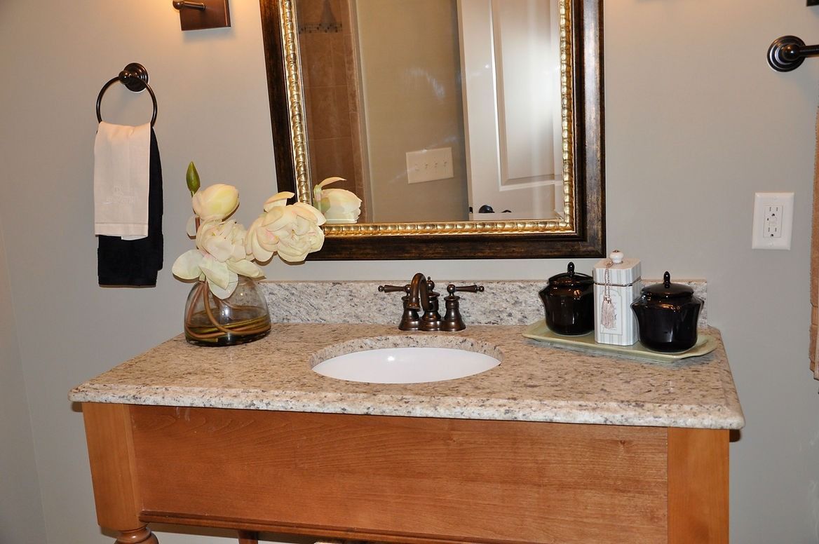 A bathroom vanity with a sink and a mirror