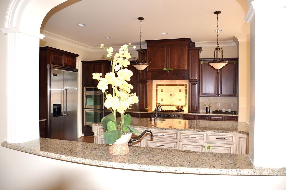 A kitchen with stainless steel appliances and granite counter tops