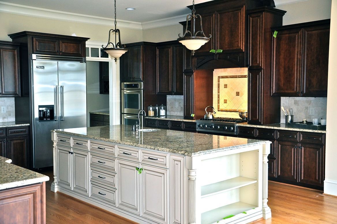 A large kitchen with a large island in the middle