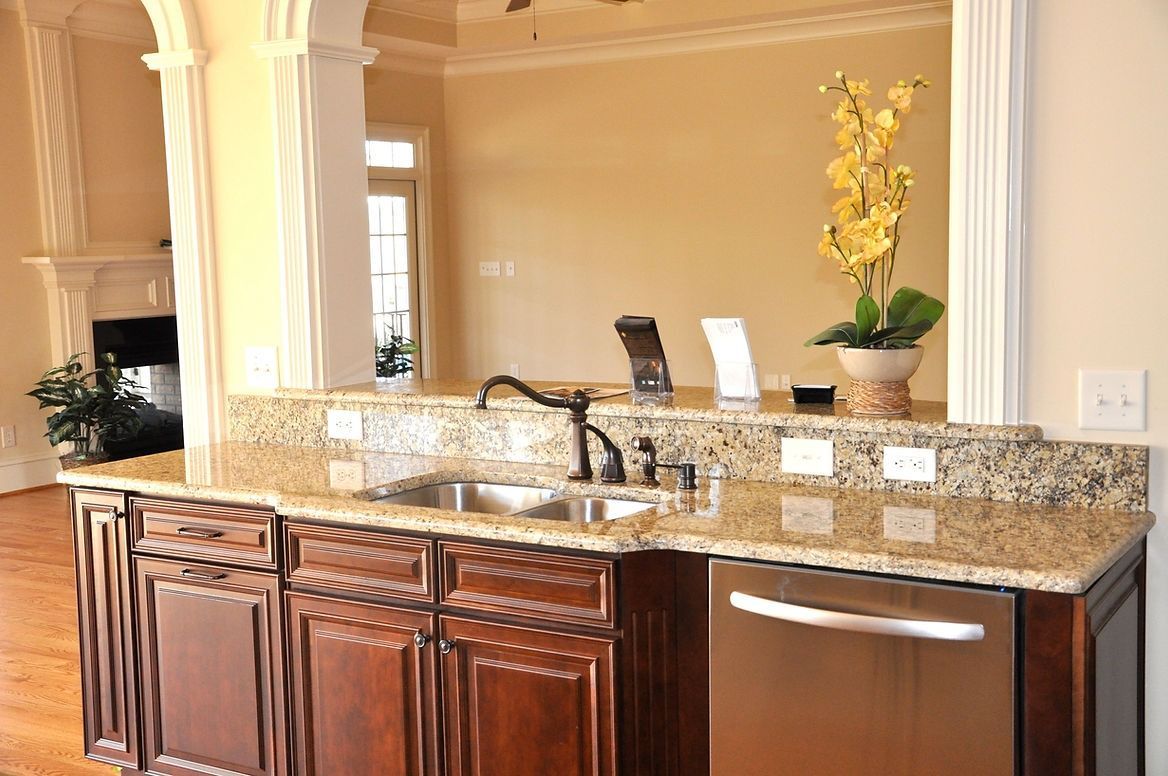 A kitchen with stainless steel appliances and granite counter tops