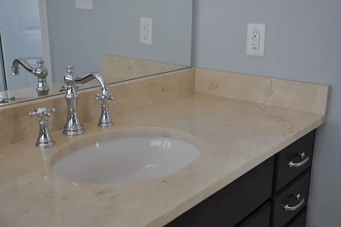 A bathroom vanity with a sink and a mirror
