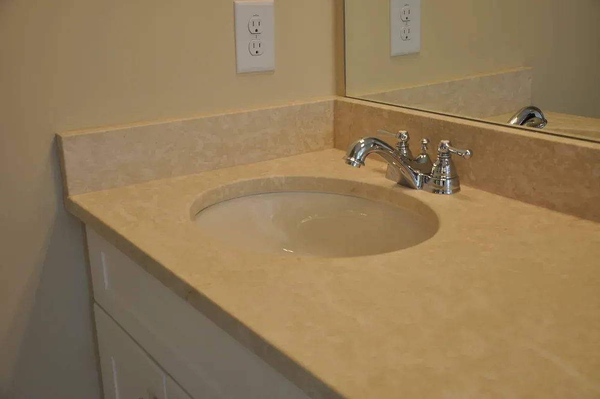 A bathroom vanity with a sink and a mirror