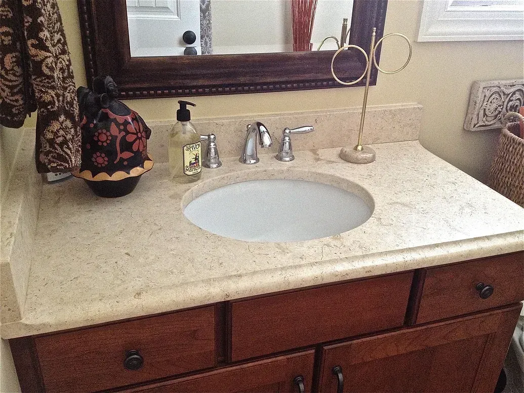 A bathroom vanity with a sink and a mirror