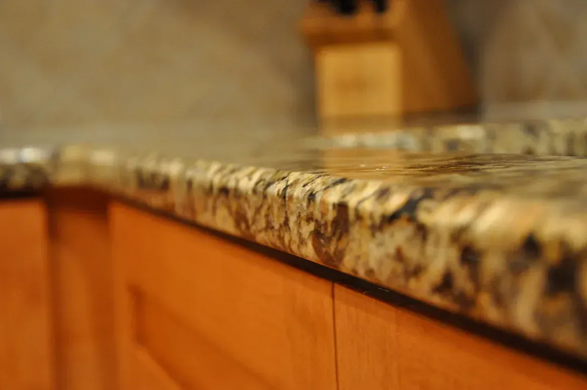 A close up of a granite counter top in a kitchen