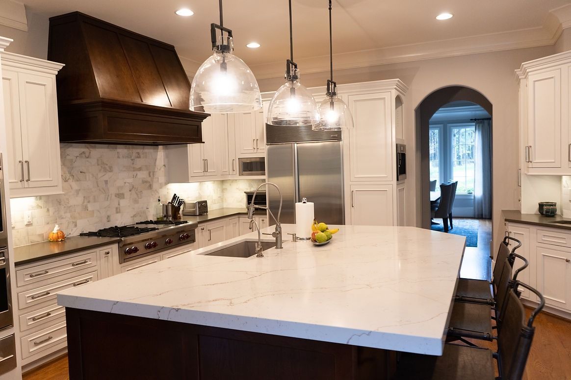 There is a large island in the middle of the kitchen.