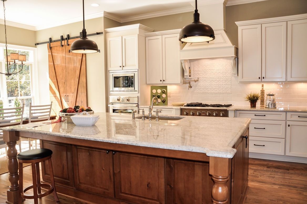 There is a large island in the middle of the kitchen.