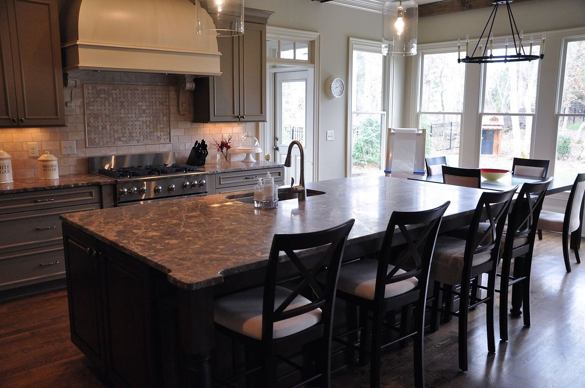 There is a large island in the middle of the kitchen.