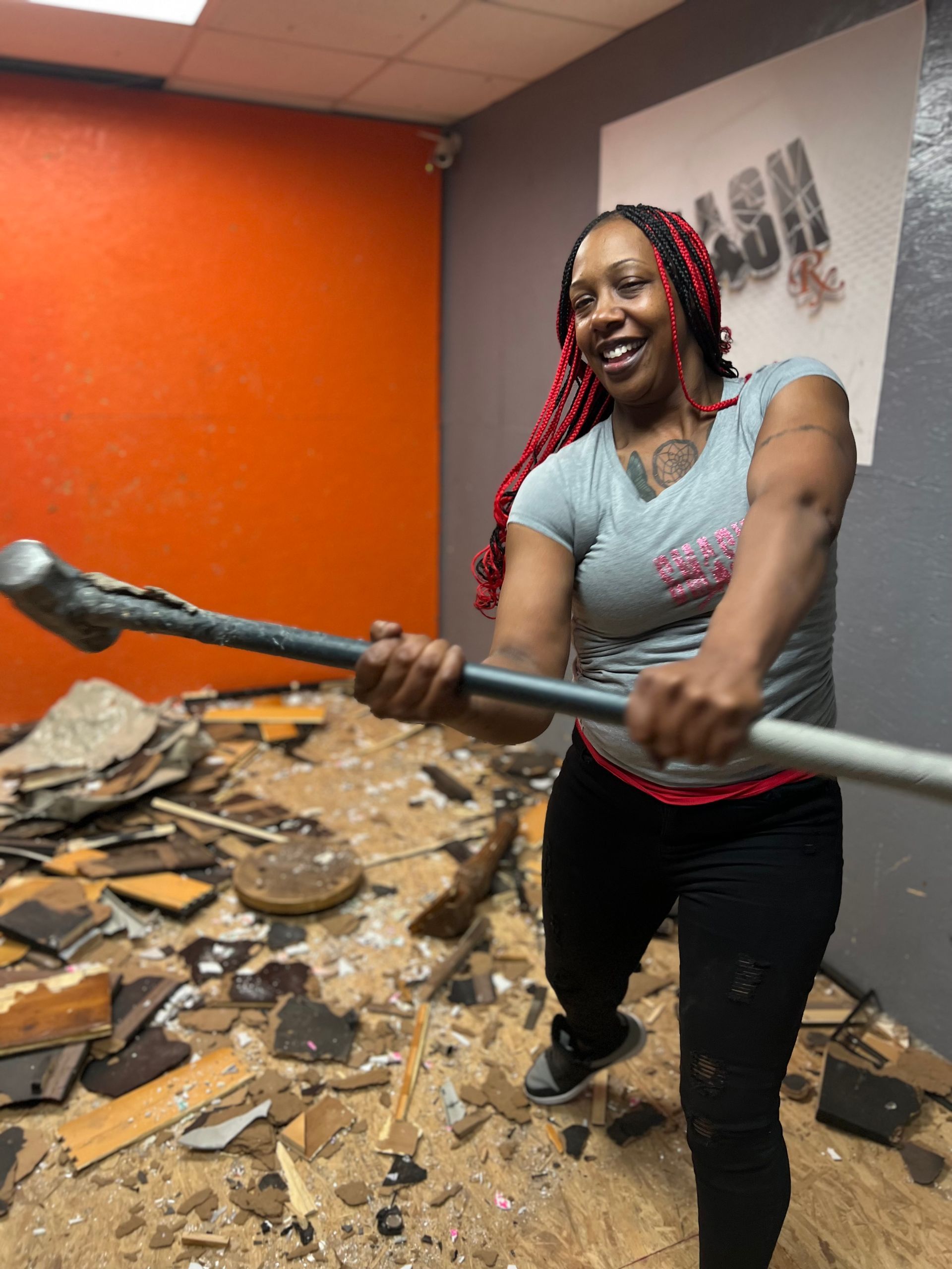 A woman holding a sledgehammer.