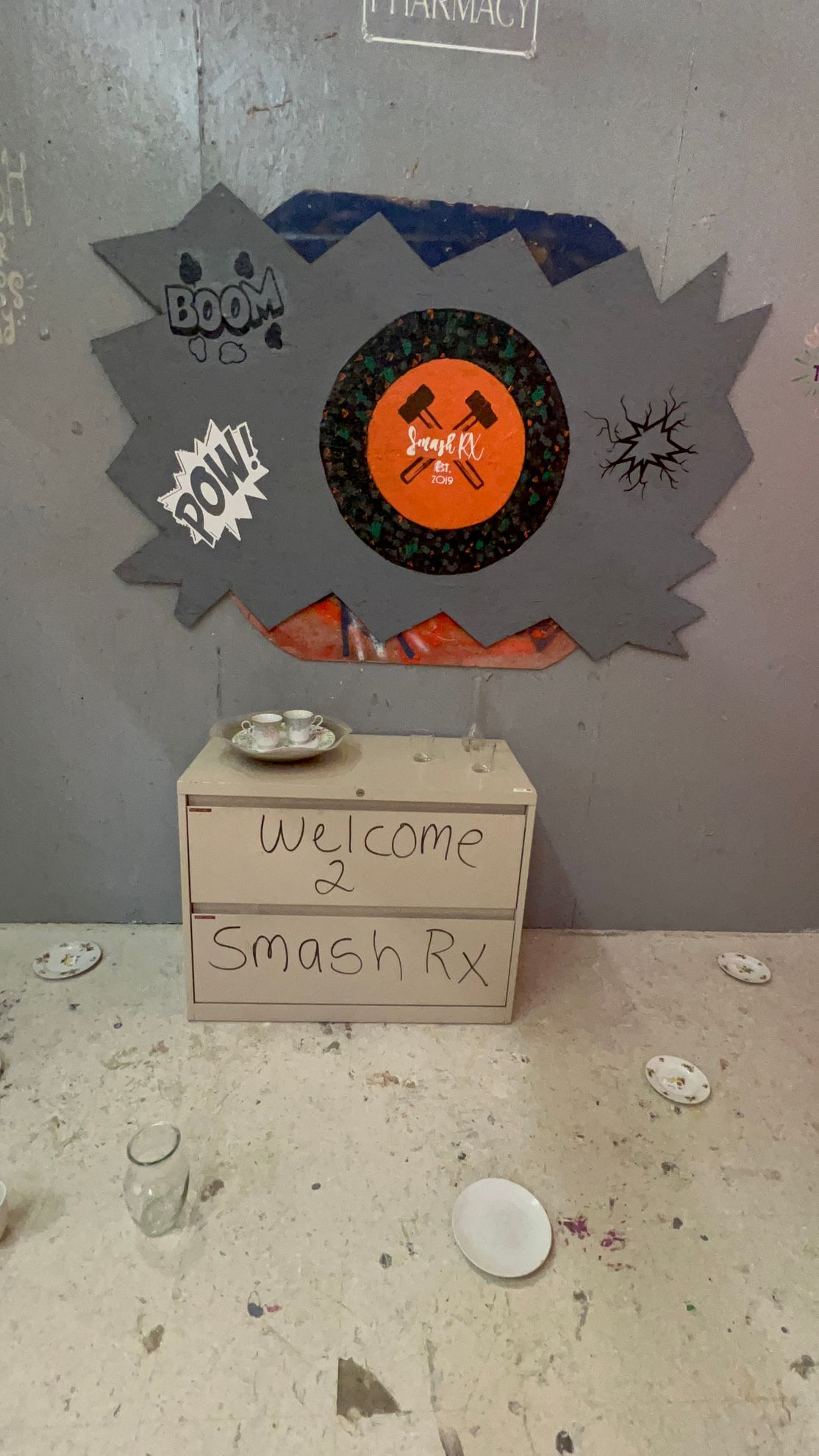 A sign on a table that says welcome to smash rx