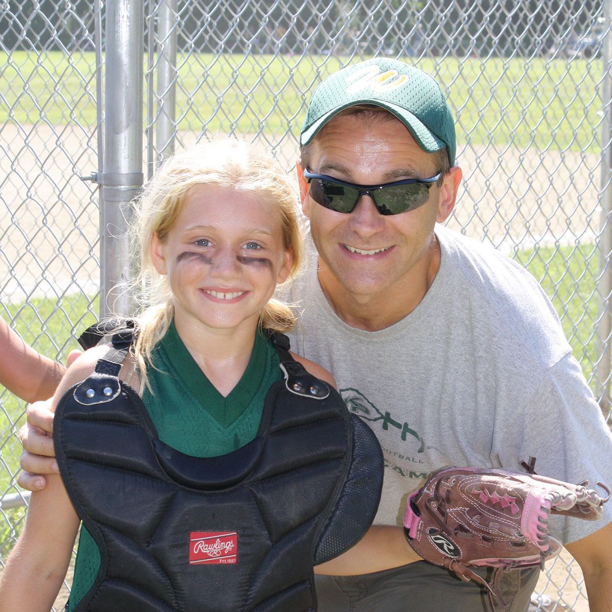 Dan Wood playing baseball with his daughter