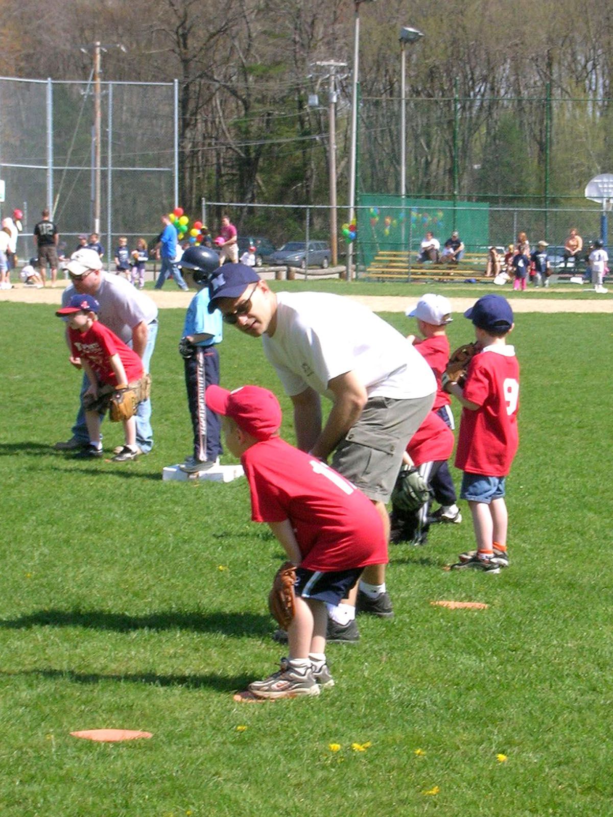 Dan Wood playing baseball with his son