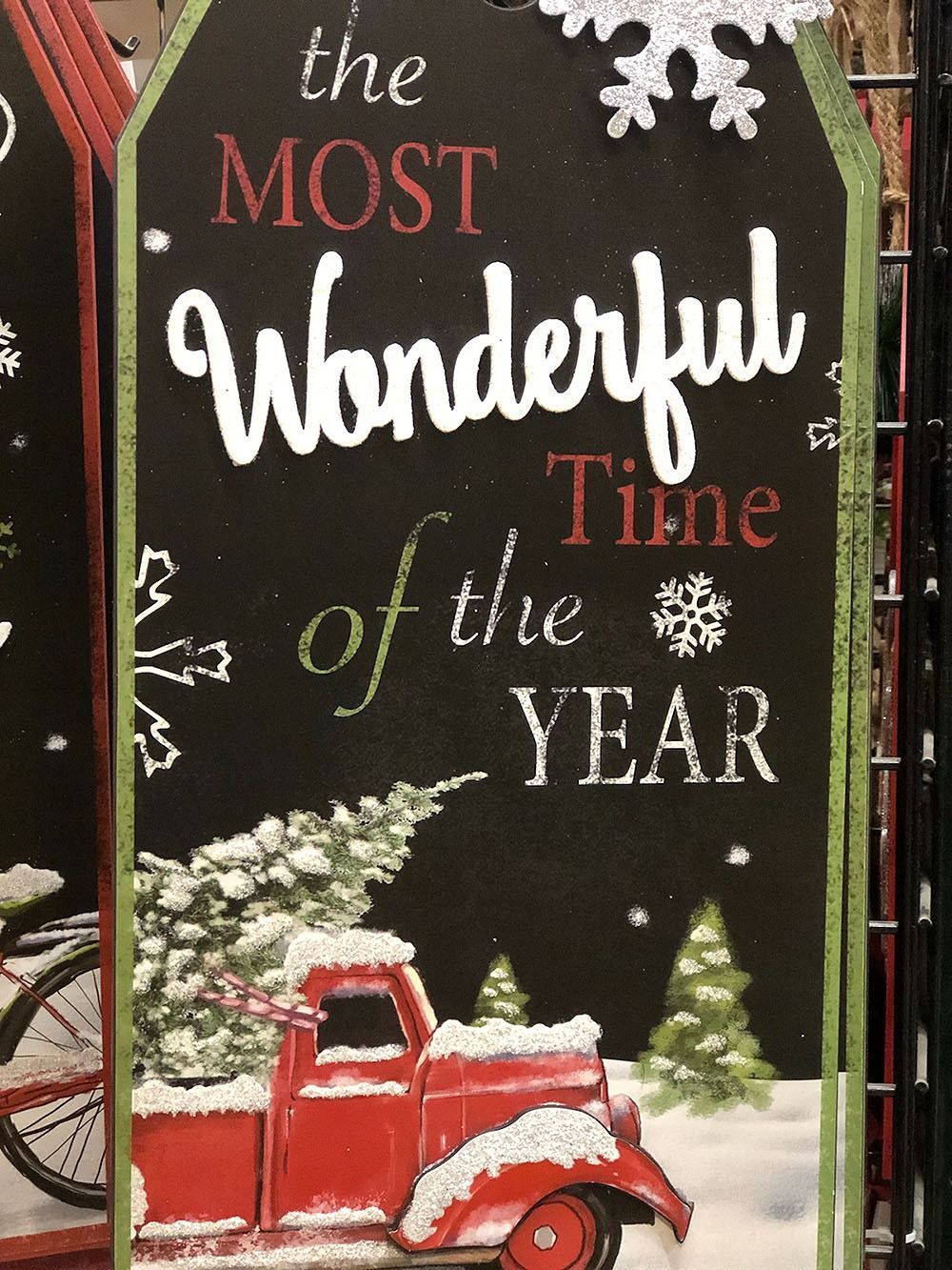 Christmas tag: Red truck hauling a snowy tree, the phrase