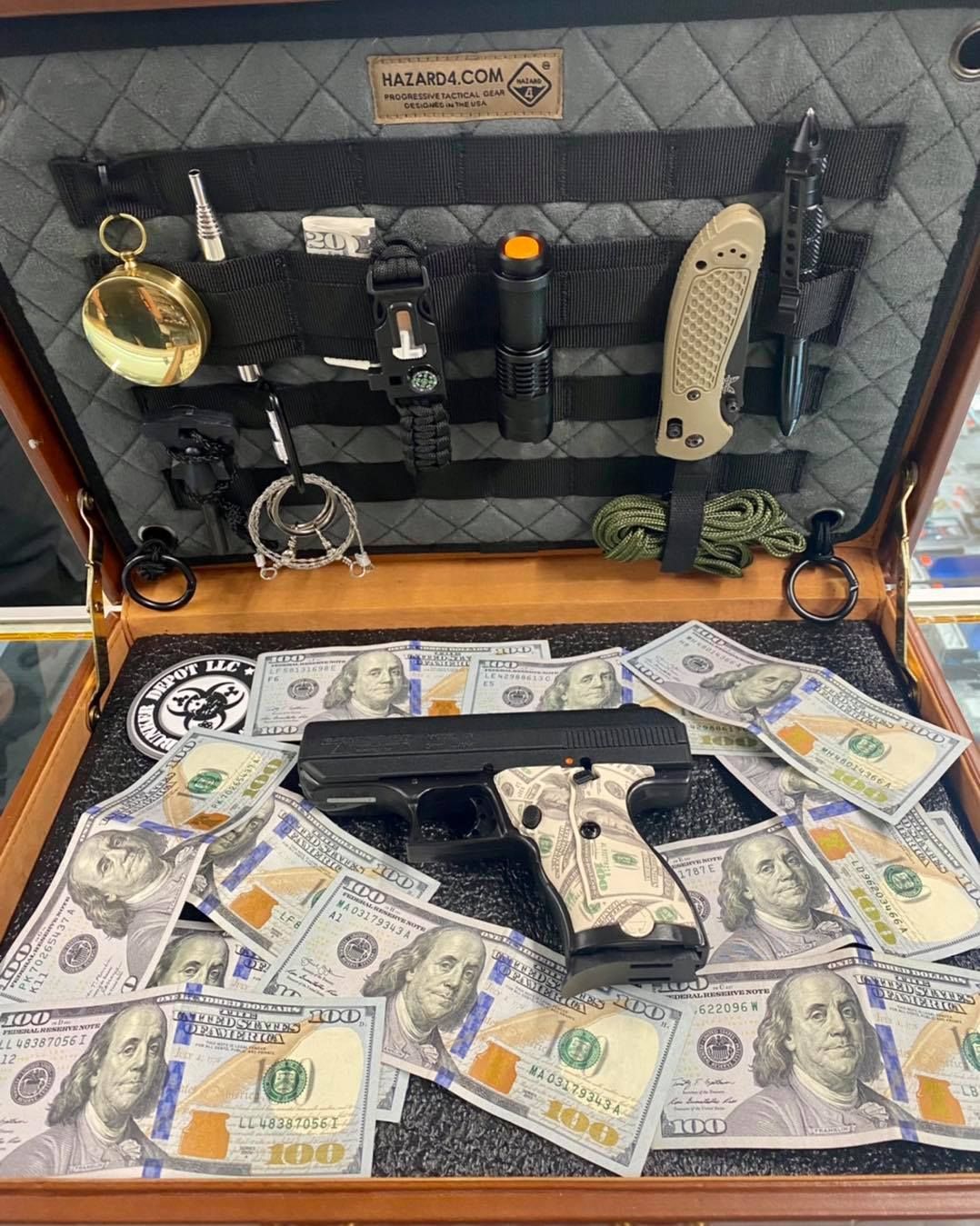 Guns, ammos, and dollars inside a case.