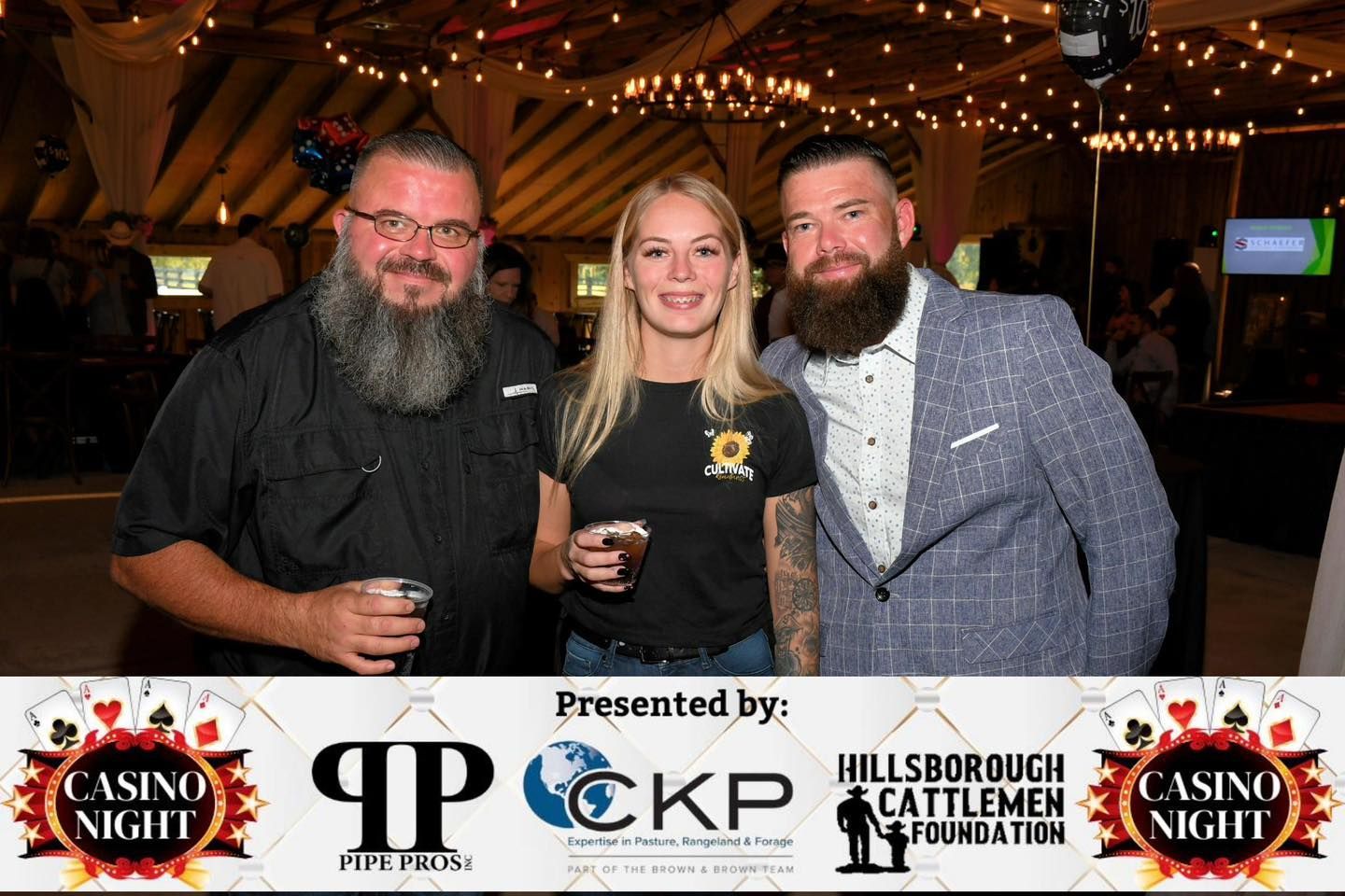 A group of people standing next to each other in a room.