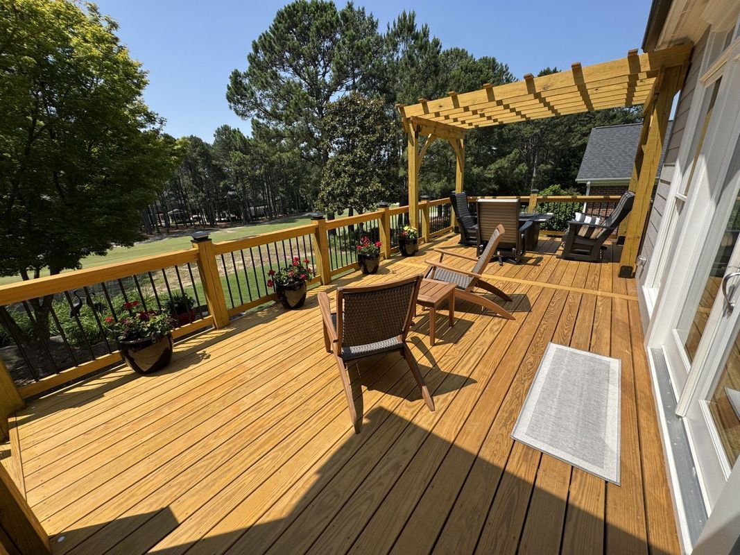 wooden deck with seating, pergola, and potted plants