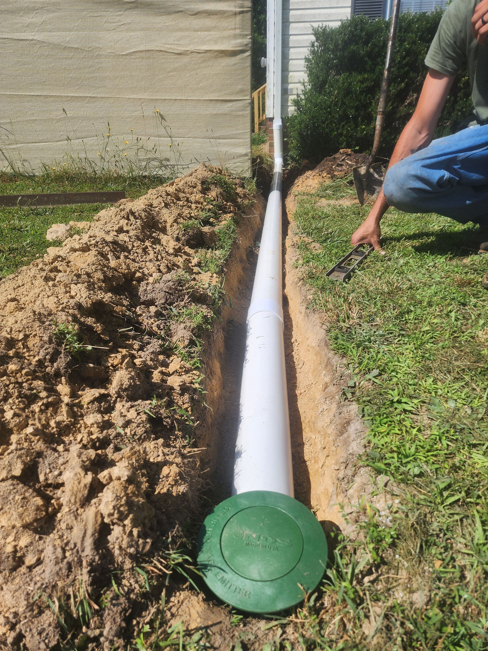 A  white pipe in the dirt