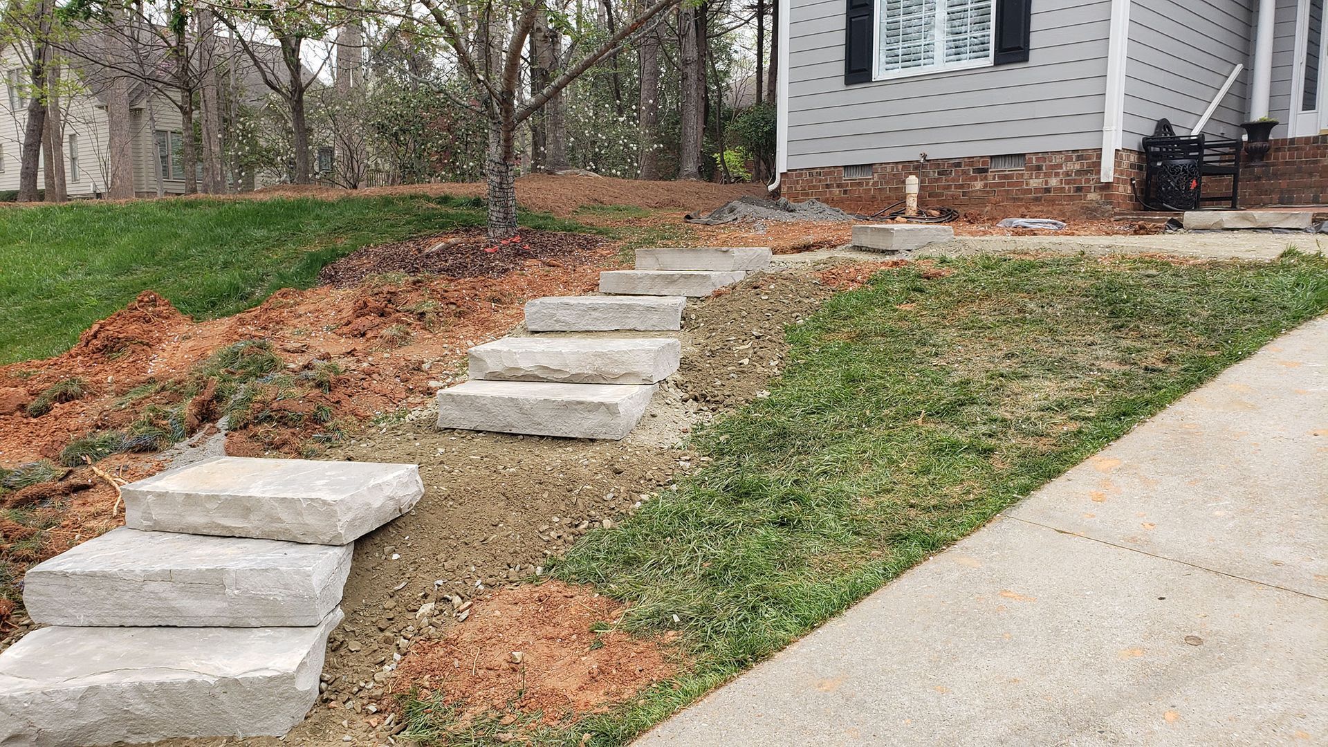 A stone steps leading up to a house.